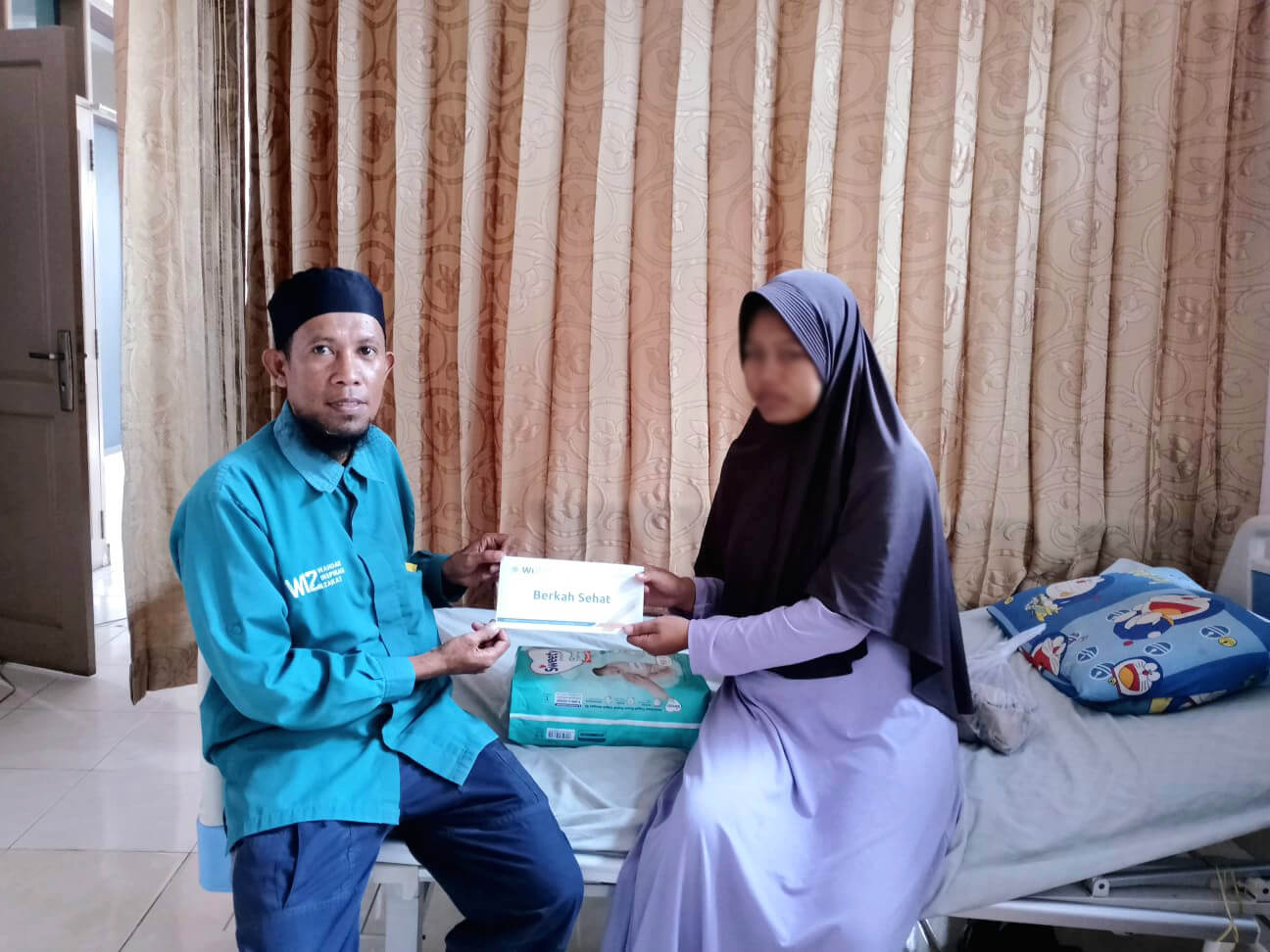 WIZ Berikan Bantuan Perlengkapan Bayi kepada Keluarga Dhuafa di Parigi Moutong